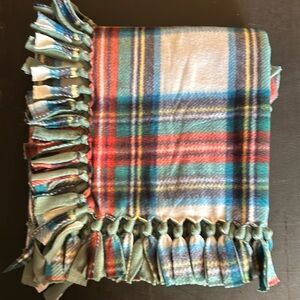 50x60” fleece tie blanket.  Plaid pattern fleece with light green fleece backing